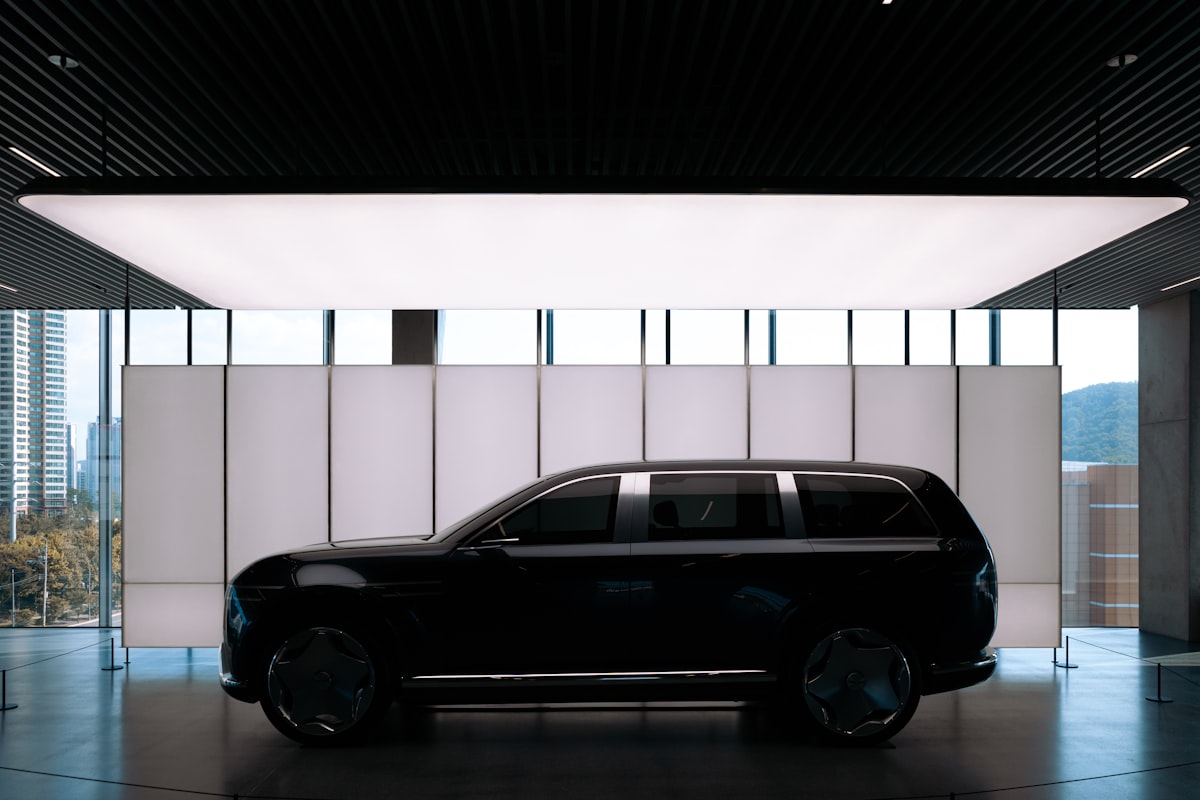 2026 Genesis GV70 Sport Prestige in dark gray on a coastal road