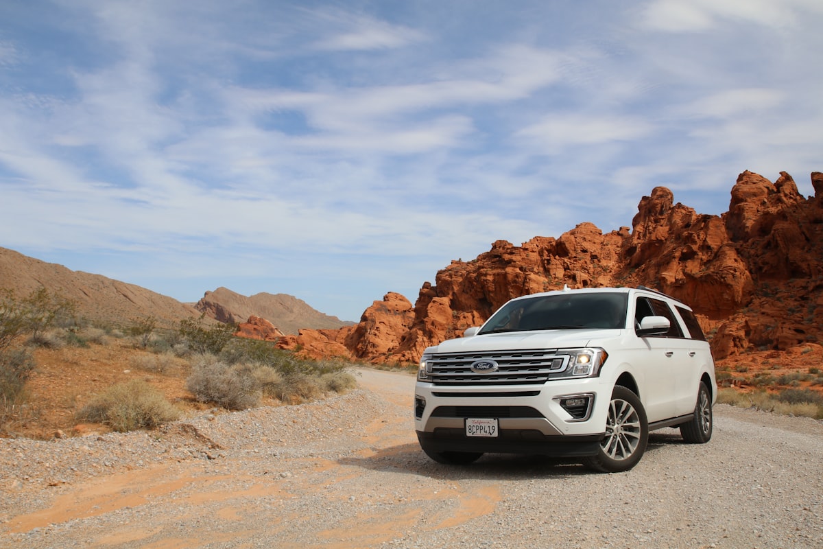 2026 Nissan Rogue and Hyundai Tucson parked at a trailhead