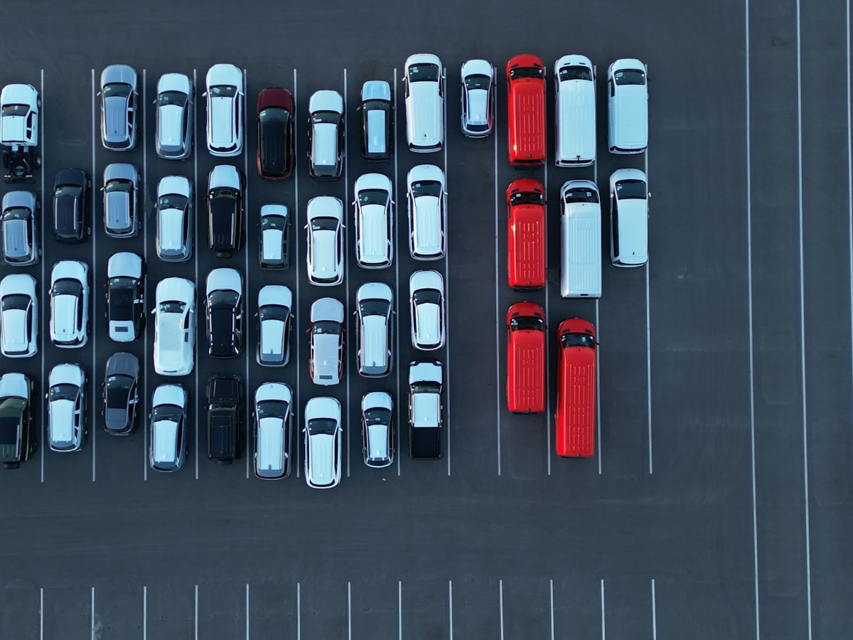 Certified pre-owned vehicles lined up at a franchise dealership lot