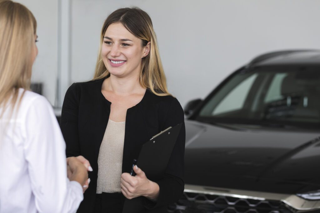 Dealer appraiser inspecting a customer's vehicle for trade-in value