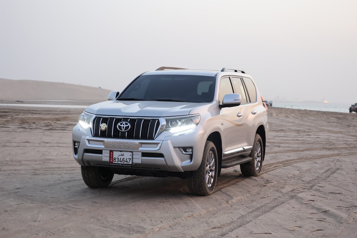 A Toyota three-row SUV parked outdoors at dusk